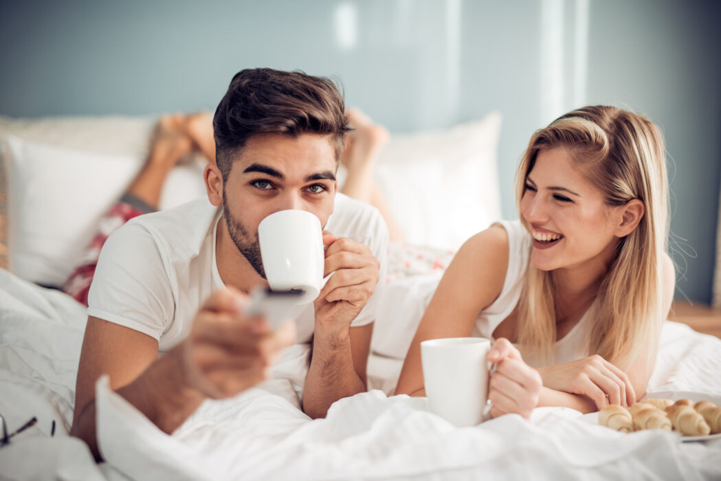 Young loving couple in the bed